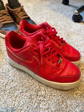 Nike Air Force 1’s - Red Leather Low-Top Sneakers with Gold Trim Swoosh
